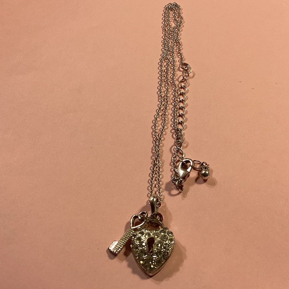 Silver toned heart locket with crystals